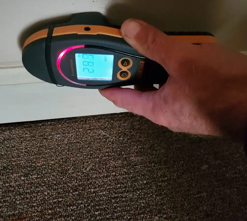 Moisture detection at baseboard during Storm Damage Restoration in Estherville